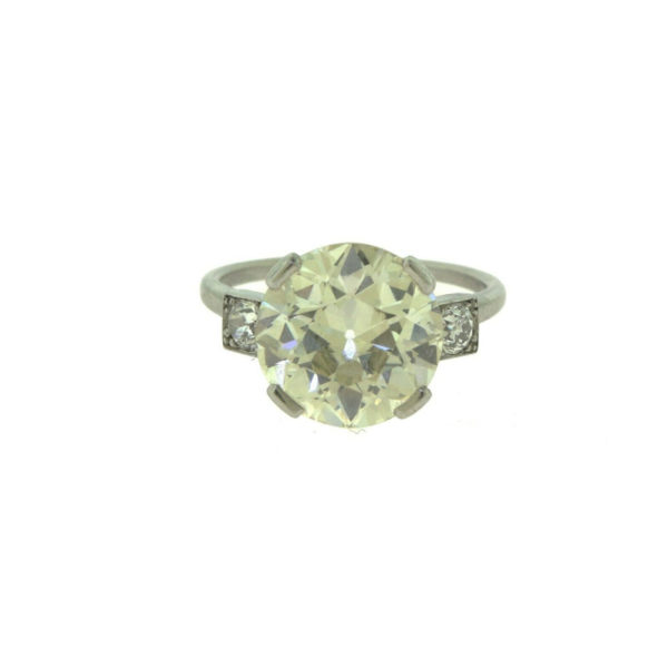 one 5.15ct old mine cut diamond with two side stone ring